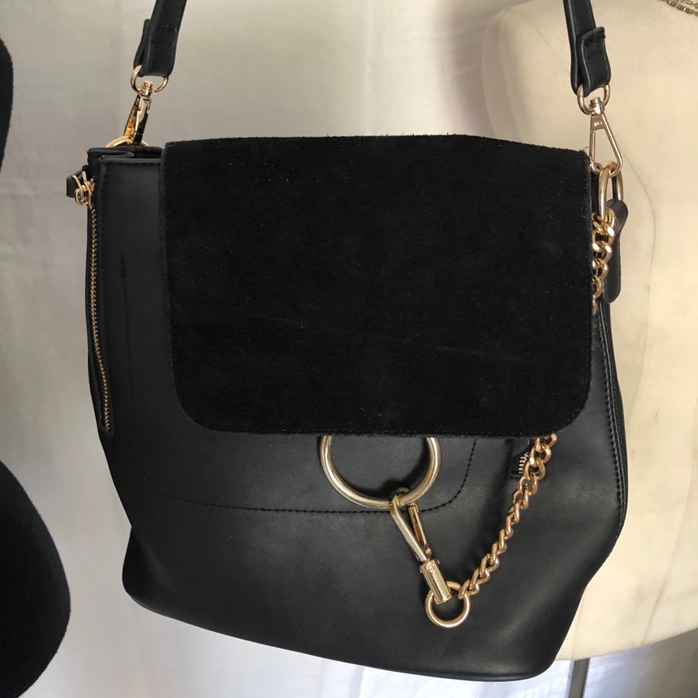 Moda luxe black handbag, gold chain and suede detailing, clean inside.